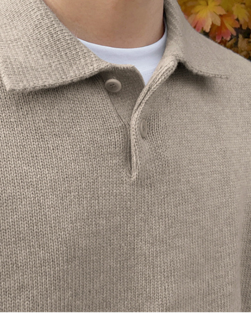 Wool sweater with buttons and half-zip closure.